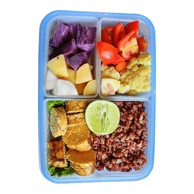 Tempeh and tofu with red rice, potato and vegetables in a Fit Food Bali bento box